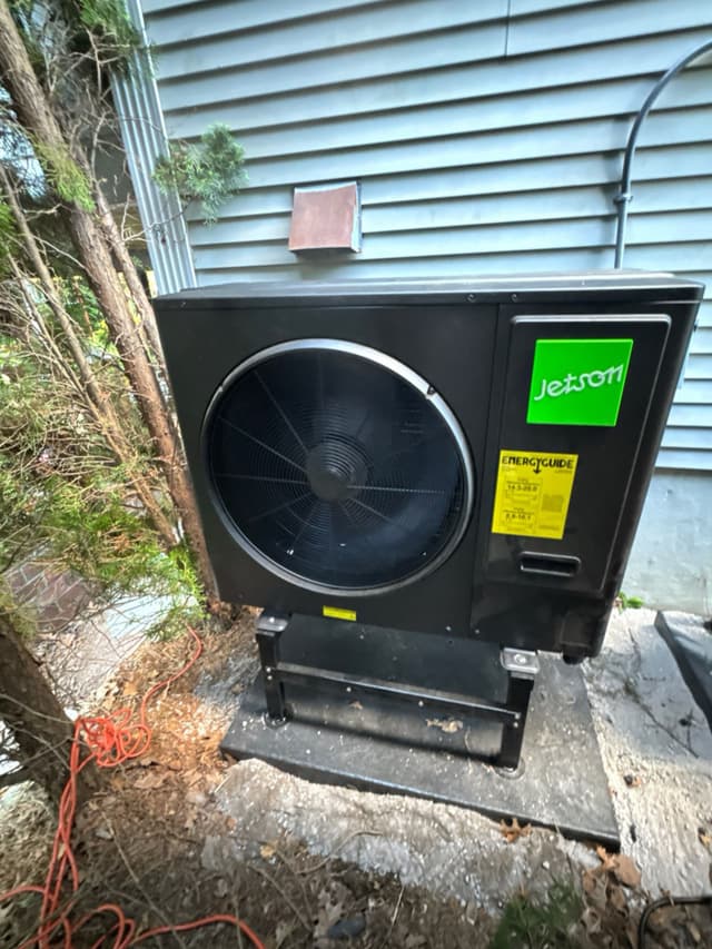 3-ton central ducted heat pump installed outside a home in Billerica, Massachusetts.