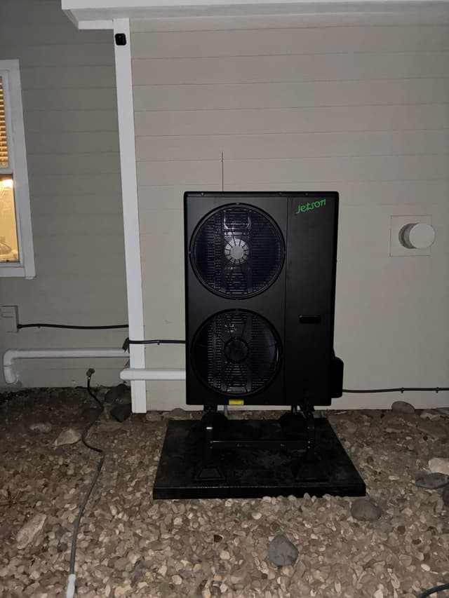 5-ton central ducted heat pump installed outside a home in Brighton, Colorado.
