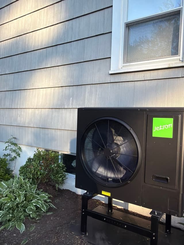 3-ton central ducted heat pump installed outside a Framingham, Massachusetts home.