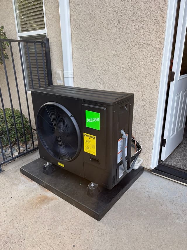 Jetson Air 3-ton outdoor heat pump condenser installed on a concrete patio against a tan stucco wall in Granite Bay, CA.