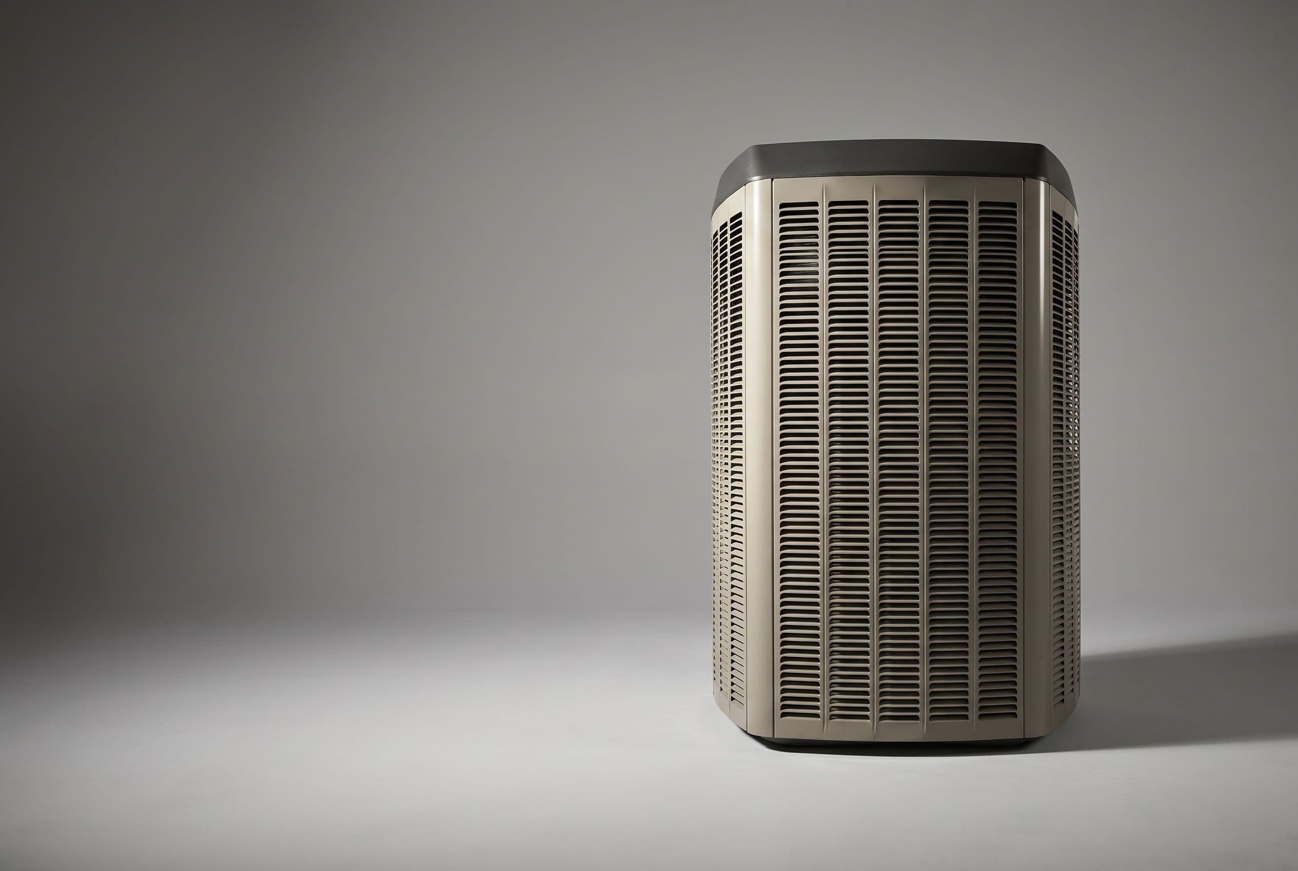 Studio photograph of a Lennox heat pump outdoor unit