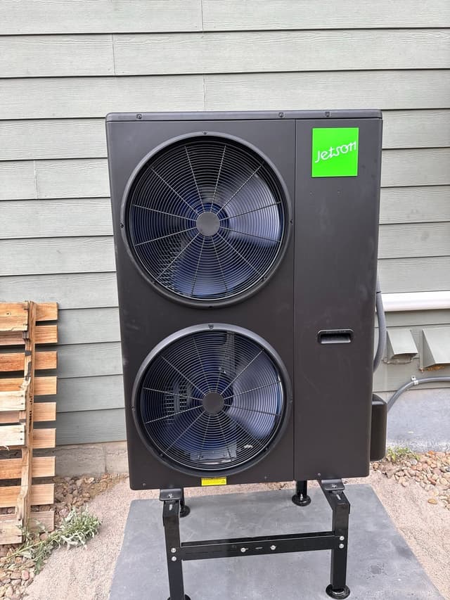 5-ton Jetson Air central ducted heat pump installed against gray lap siding at a home in Thornton.