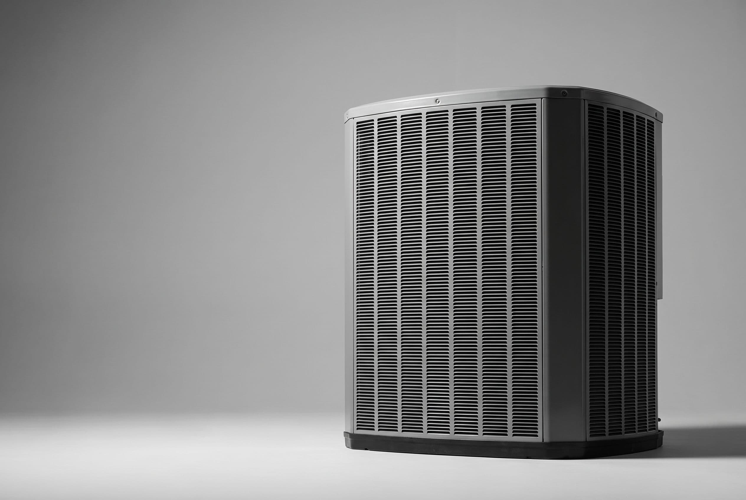 Studio photograph of Trane and Mitsubishi heat pump outdoor units