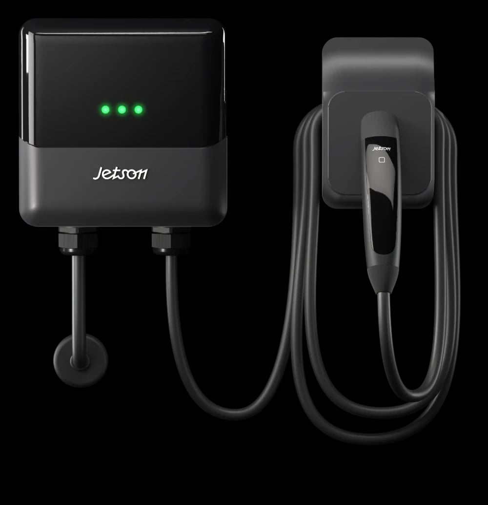 A Jetson Charge wall unit with its cable coiled on a wall holster