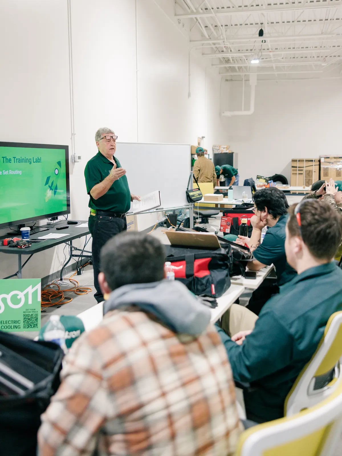 A JetStart instructor teaching a class of trainees in the training facility