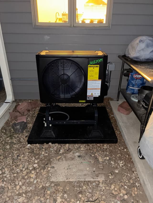 2-ton central ducted heat pump installed outside a home in Lafayette, Colorado.