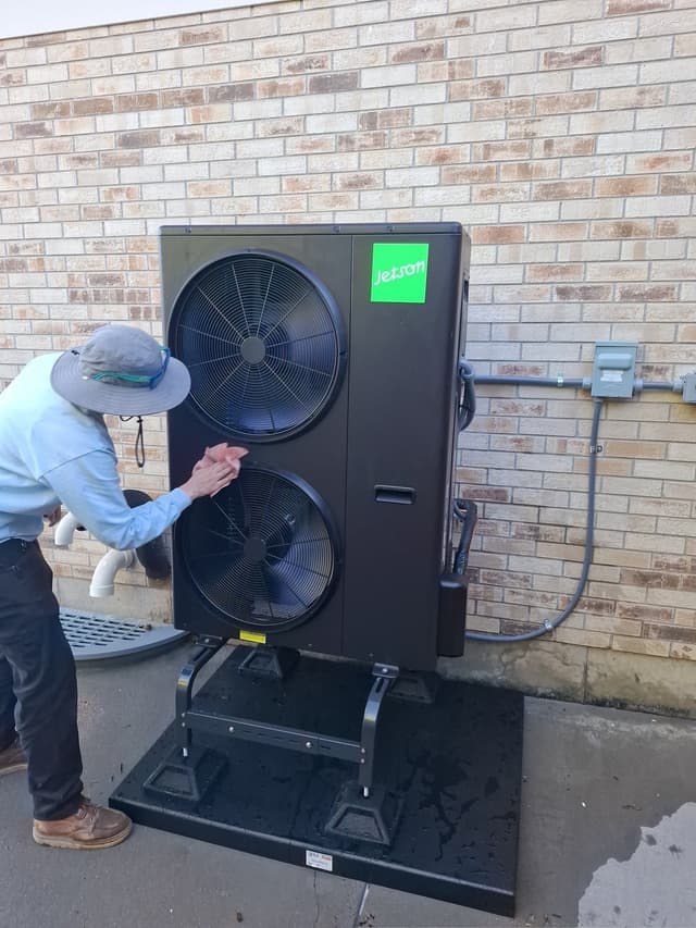 4-ton central ducted heat pump installed outside a home in Littleton, Colorado.