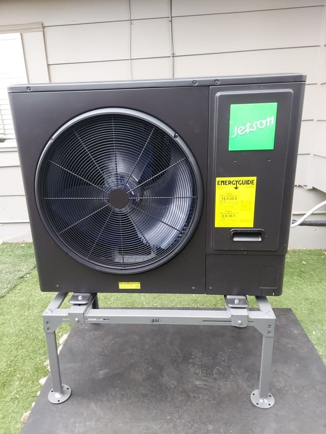 Jetson Air 3-ton central ducted heat pump installed against the exterior siding of a home in Pueblo, Colorado.